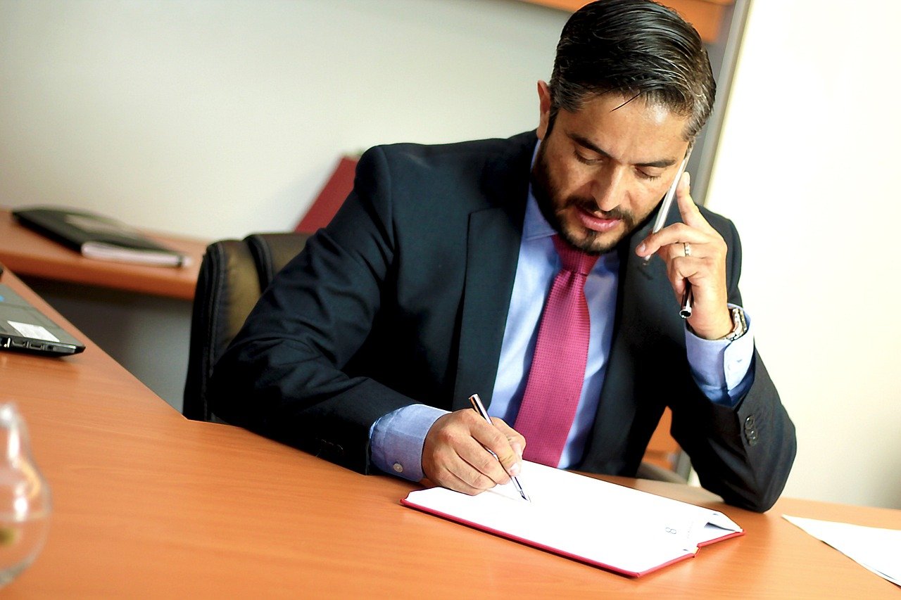 lawyer on phone while review document